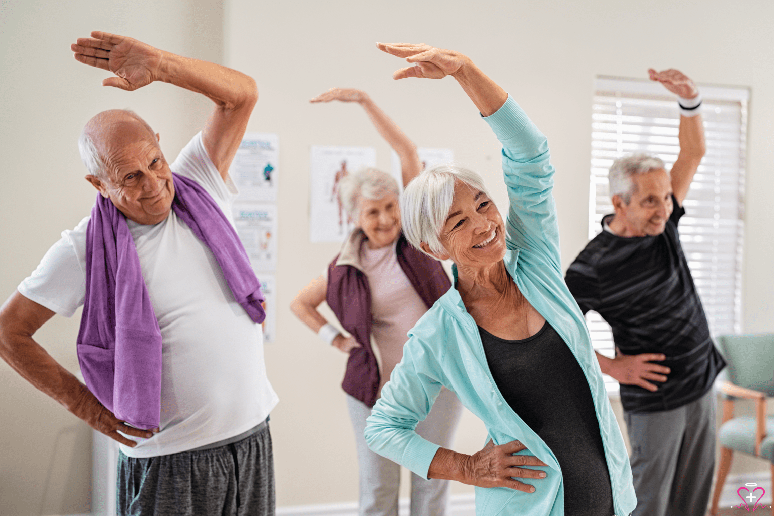 Understanding the Benefits of CBAS - A group of senior adults participating in a fitness class, smiling and stretching together.