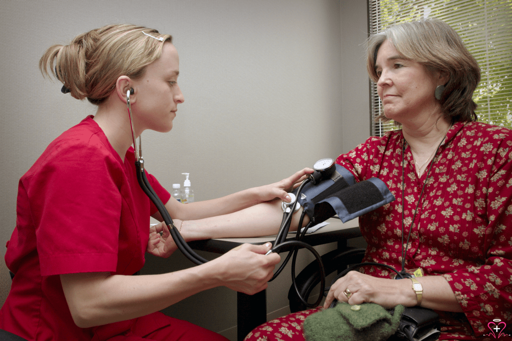 Blood Pressure Screenings - A healthcare professional taking a patient's blood pressure.