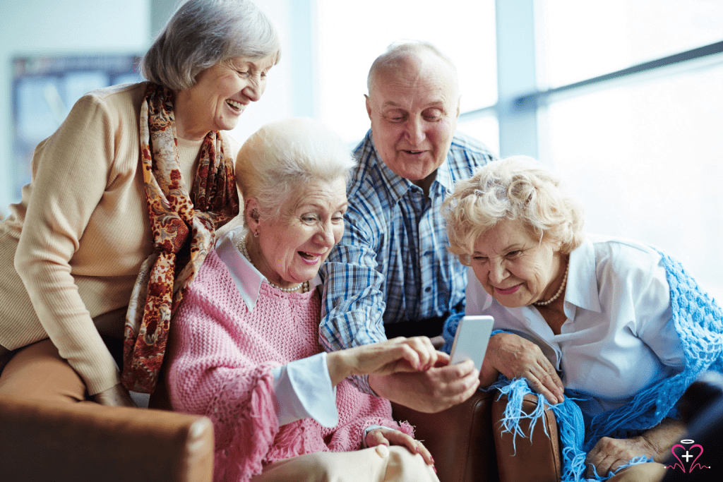 A group of happy senior citizens looking at a smartphone and sharing a moment together.