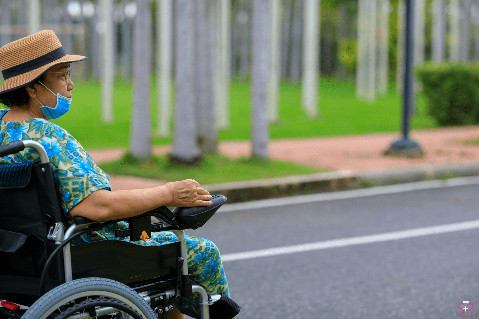 Adult woman using an electric wheelchair outdoors.