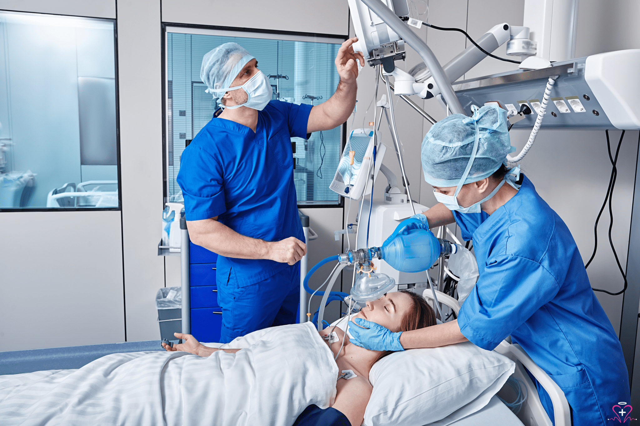 Medical staff using a ventilator on a patient in a hospital setting.