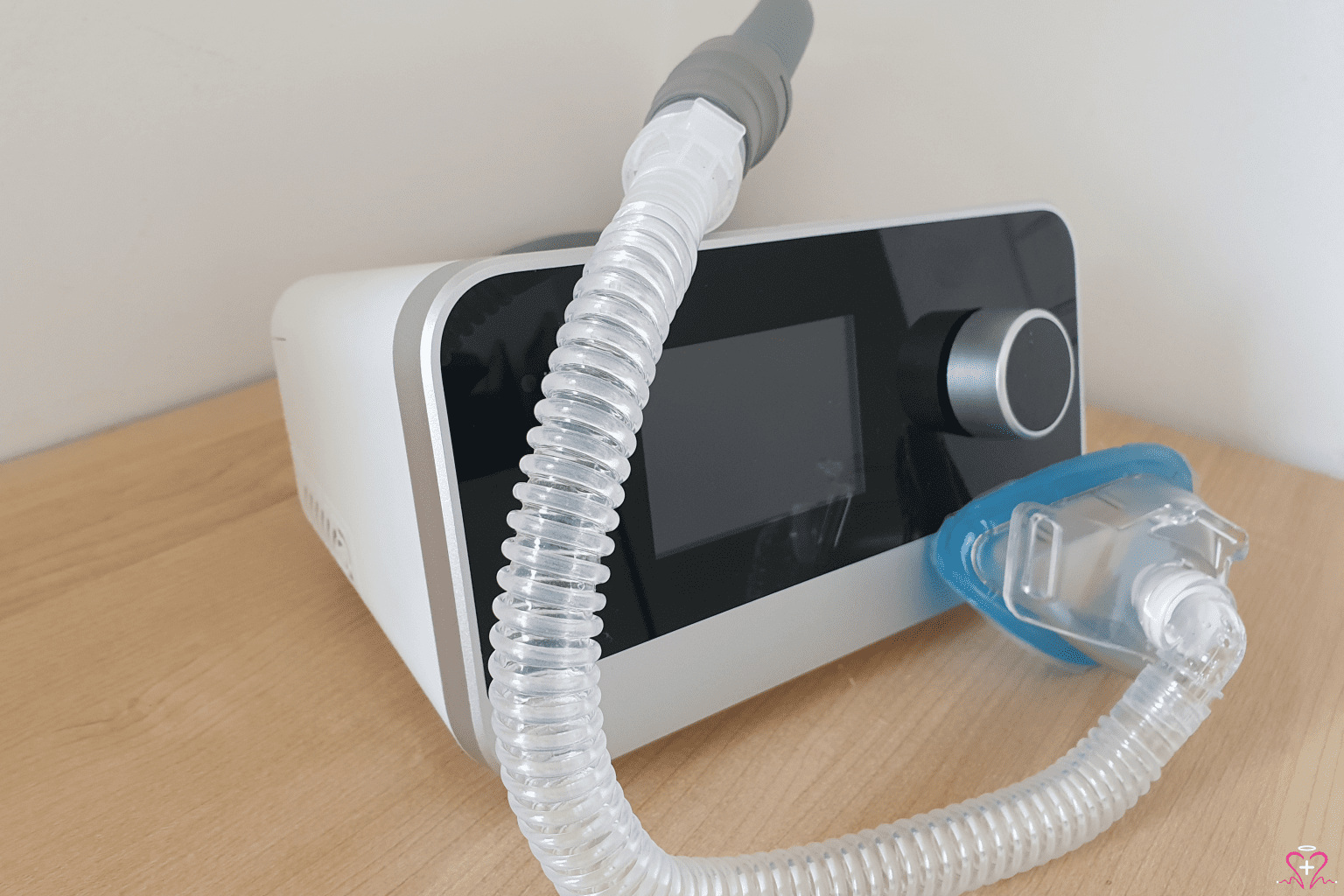 Close-up of a CPAP machine with a mask and tubing.