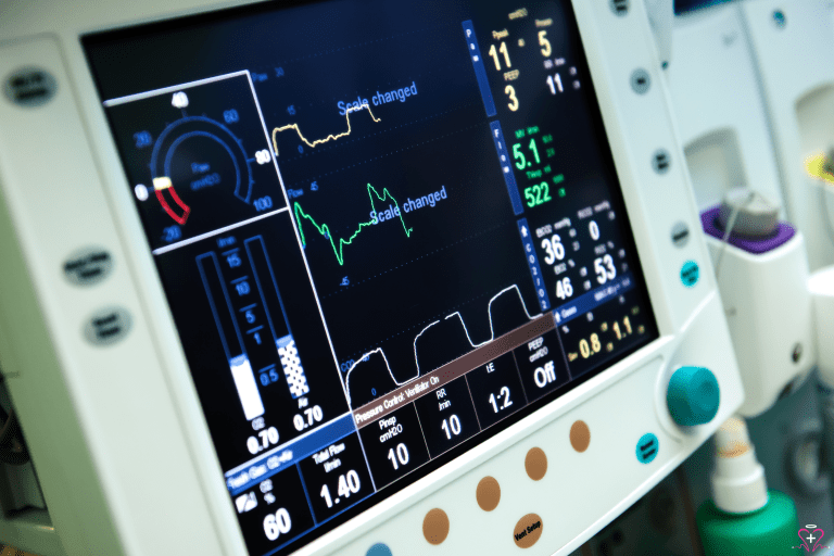 Close-up of a medical ventilator display showing detailed respiratory data.