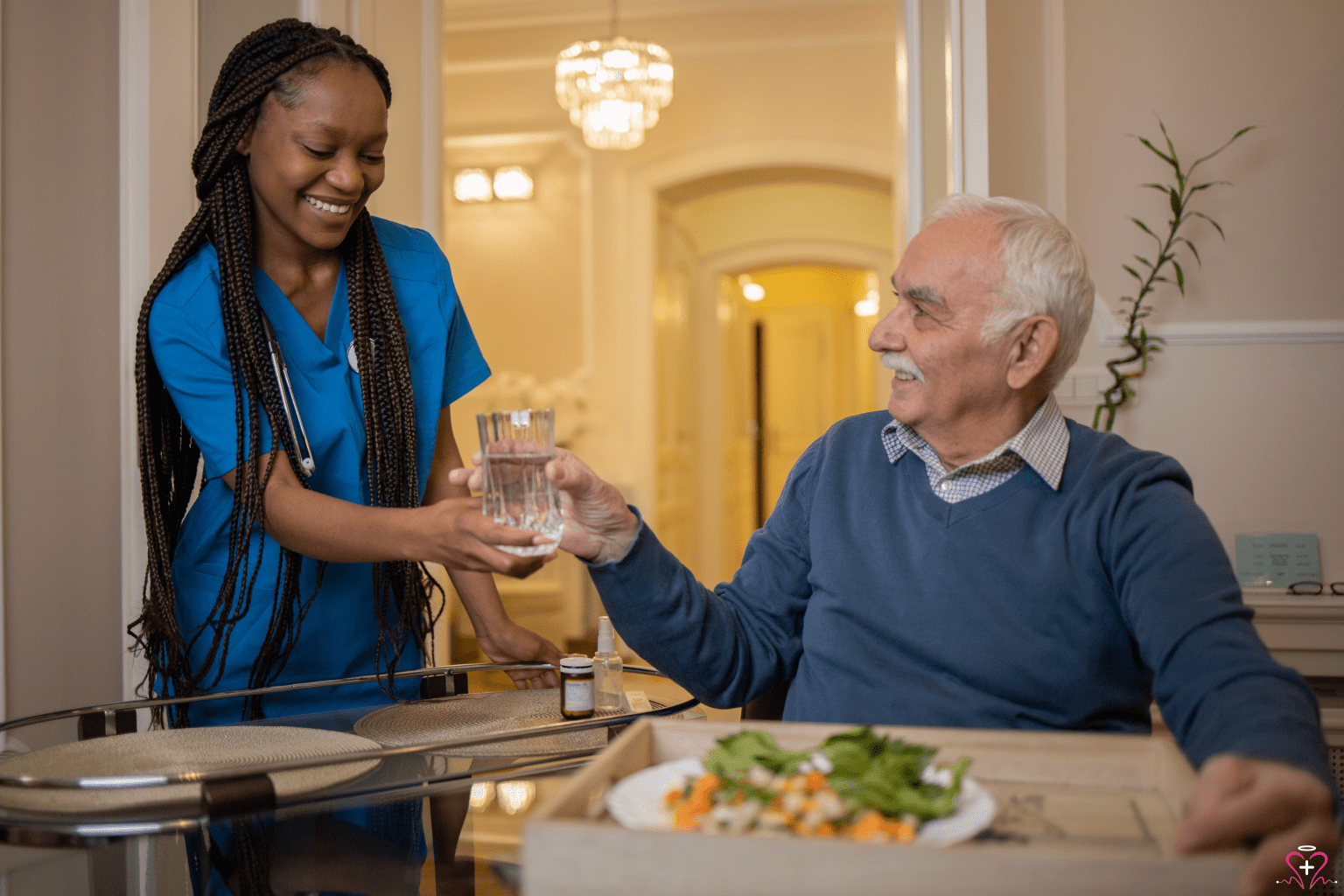 Nursing Care Services: A nurse handing a glass of water to an elderly man during mealtime.