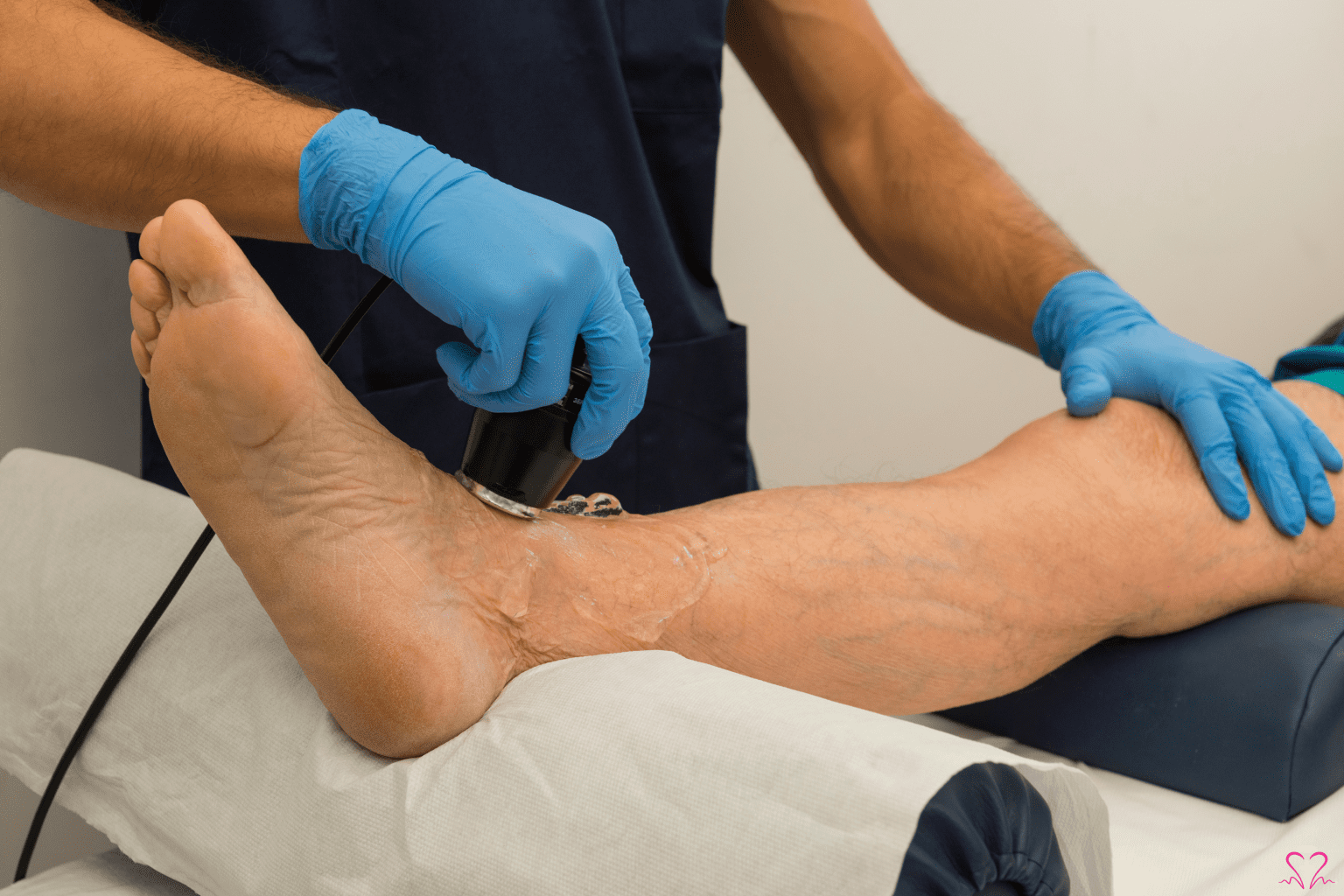 Healthcare professional providing foot care to a senior patient.