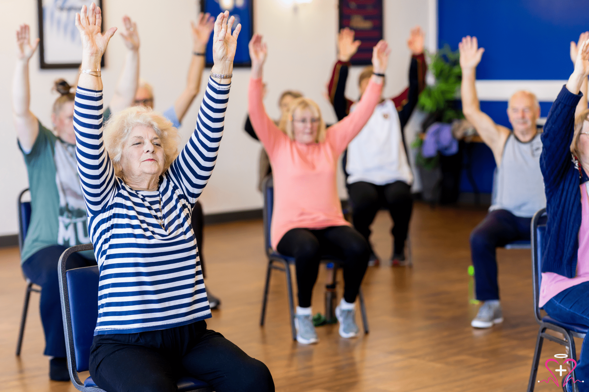 Group of senior people exercising indoors.