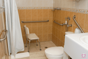 Shower Chairs - Accessible bathroom with shower chair and safety grab bars