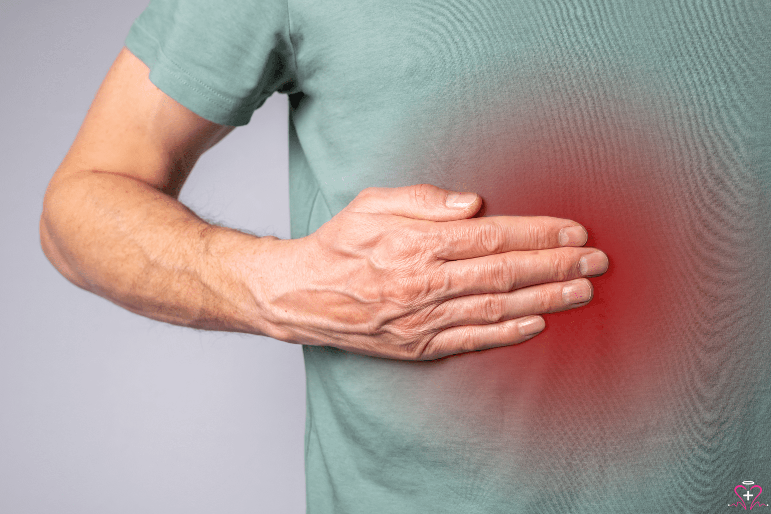 How Liver Specialists Can Help You - Person holding their abdomen, highlighting liver pain