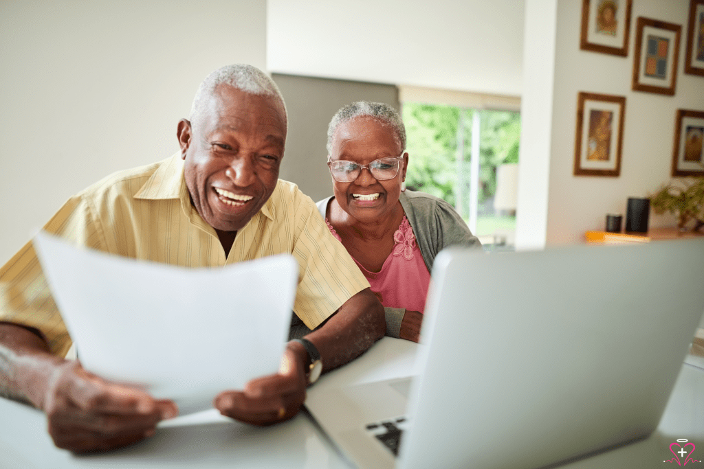 Senior couple reviewing care plan for senior documents together at home.