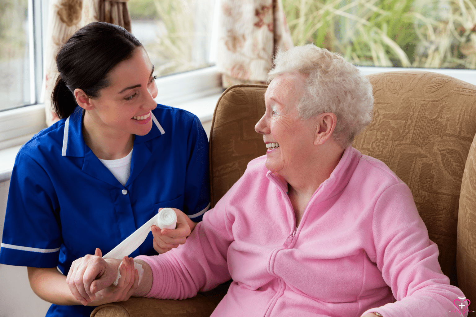 The Importance of Proper Wound Care - Nurse providing wound care to a smiling elderly woman