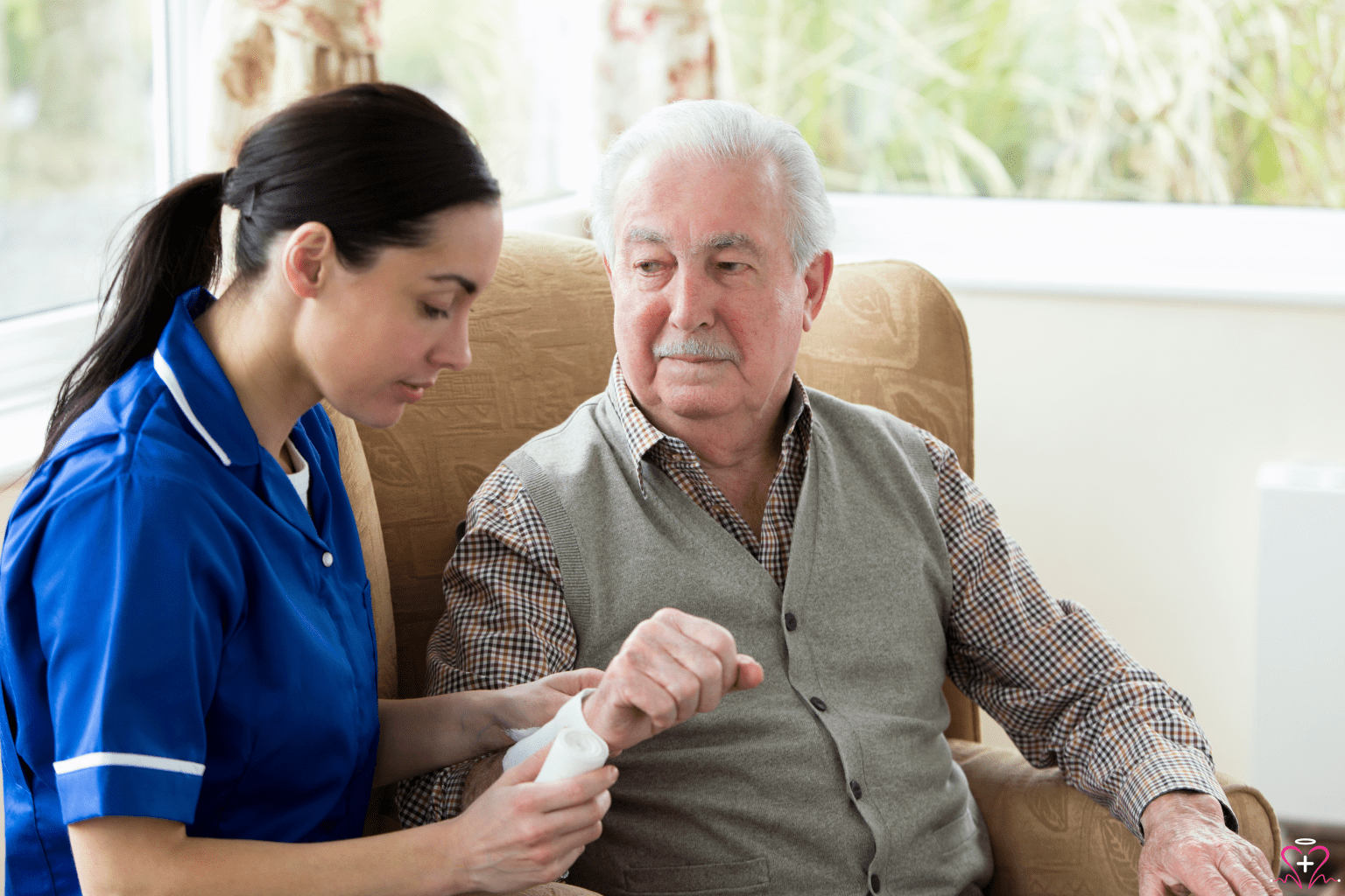 Wound Care - A nurse in a blue uniform is providing wound care to an elderly man, wrapping a bandage around his wrist in a cozy home setting.