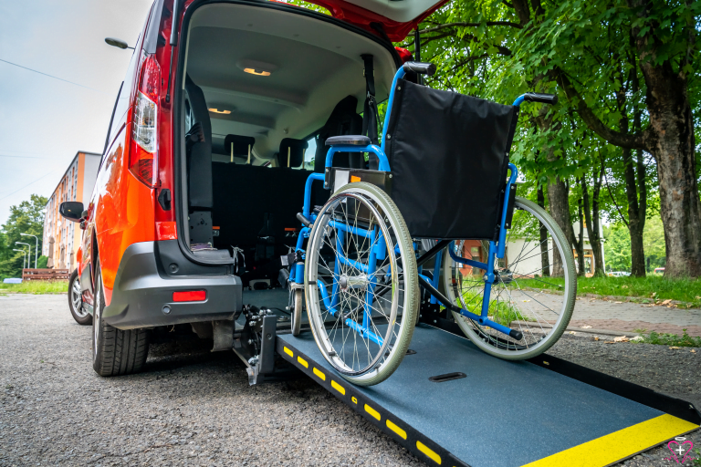 Non-Emergency Medical Transportation - A wheelchair positioned on a ramp leading into a van, showcasing non-emergency medical transportation.