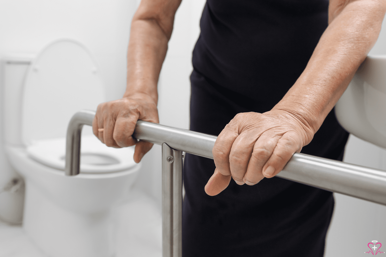 Benefits of Using Safety Rails - Elderly person using safety rails in the bathroom