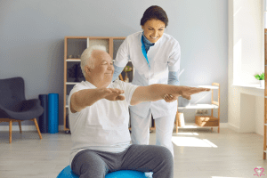 Understanding the Stages of Stroke Recovery - Senior man doing rehabilitation exercises with a physical therapist