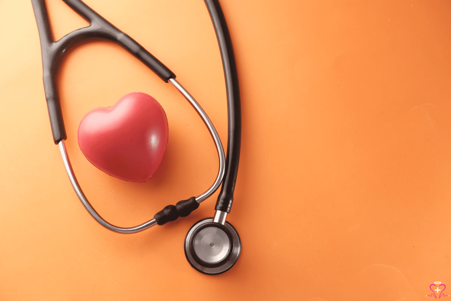 Effective Strategies for Heart Disease Management - Stethoscope with a heart shape on an orange background