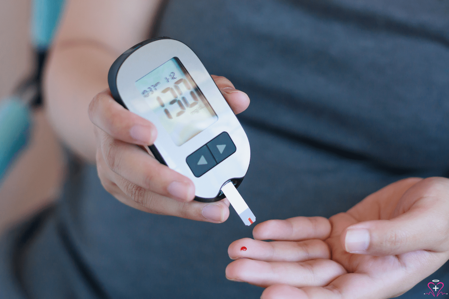 The Best Blood Glucose Monitors - Person using a blood glucose monitor