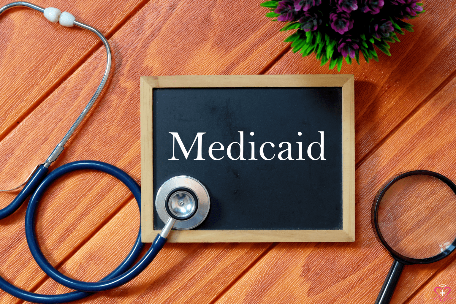 Understanding the Basics of Medicaid Applications - Chalkboard with the word Medicaid and a stethoscope