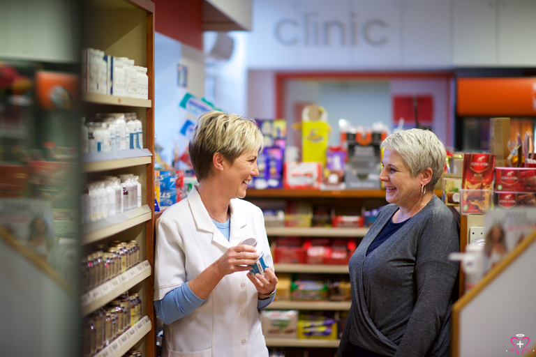 How to Properly Store Medications at Home - A pharmacist advising a customer on proper medication storage at a pharmacy.