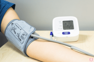 The Best Blood Pressure Monitors - Person using a digital blood pressure monitor on their arm