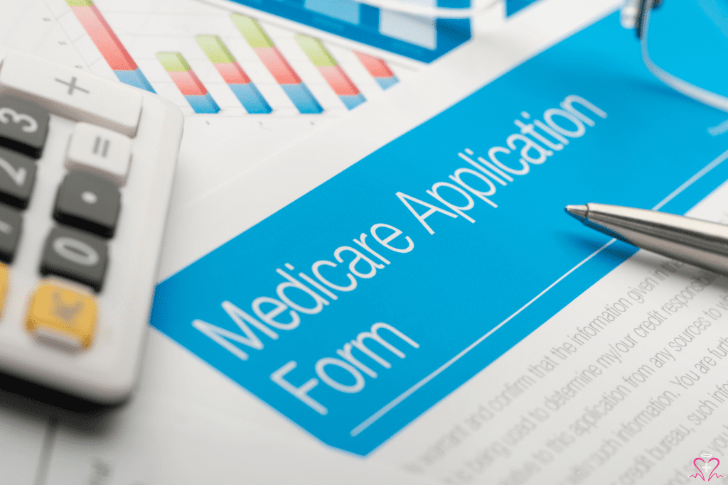 Medicare Applications - A Medicare application form with a pen and a calculator on top of it.