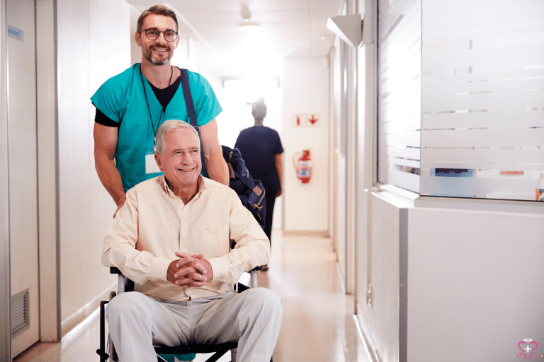 Post-Hospital Discharge Care - A healthcare worker assisting an elderly man in a wheelchair down a hospital hallway.