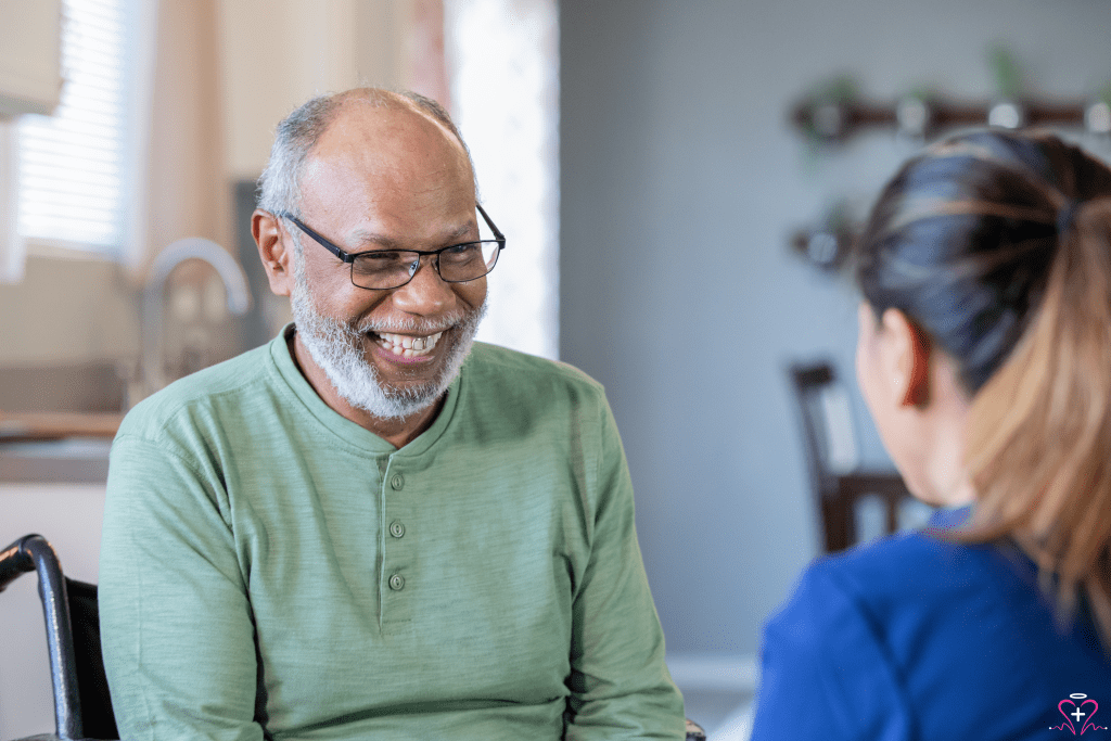 Home Health Aides - A smiling elderly man interacting with a home health aide.