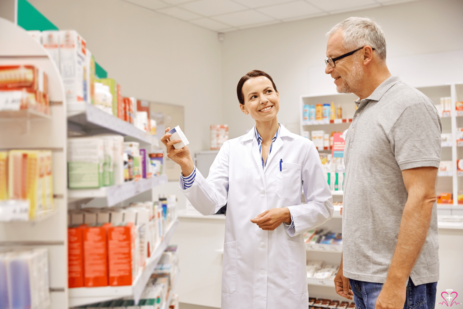 Pharmacy Help - A pharmacist assisting a customer in a pharmacy aisle, smiling and holding a medication box.