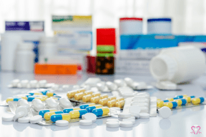 pharmacy - A variety of pills and medication bottles on a table, representing pharmacy services.