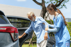 Protective Supervision - Caregiver assisting an elderly man out of a car.