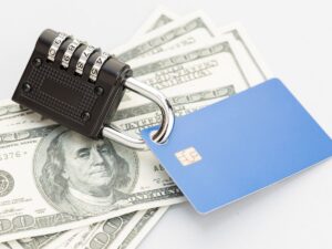 Senior woman reviewing finances and protecting against financial exploitation and fraud — All Seniors Foundation