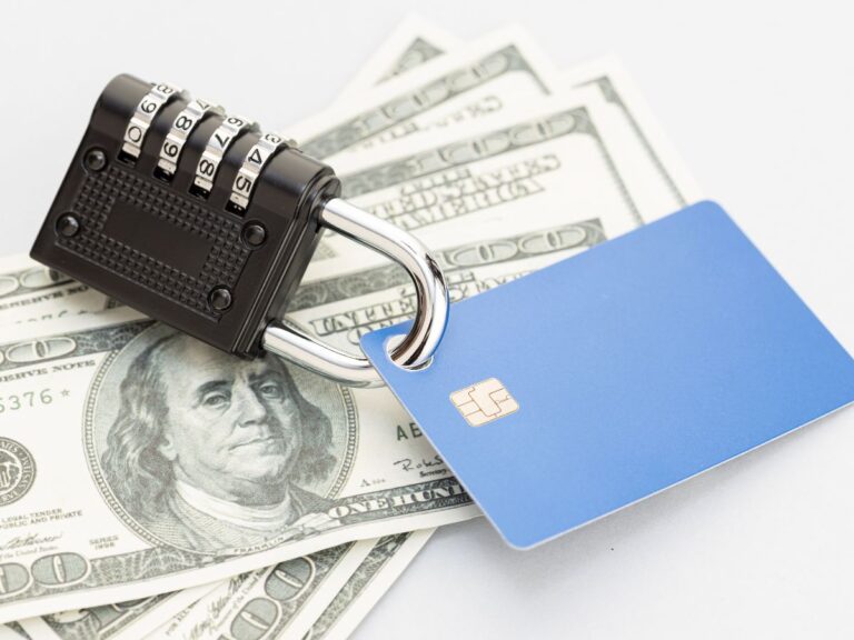 Senior woman reviewing finances and protecting against financial exploitation and fraud — All Seniors Foundation