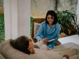 Hospice nurse comforting a senior patient – compassionate end-of-life care and hospice placement services in Los Angeles.