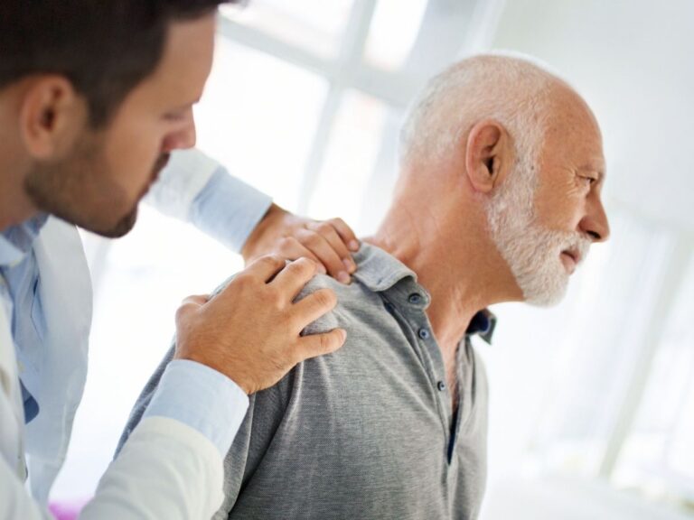 Senior man receiving shoulder therapy – dislocated shoulder treatment and rehabilitation for seniors in Los Angeles.