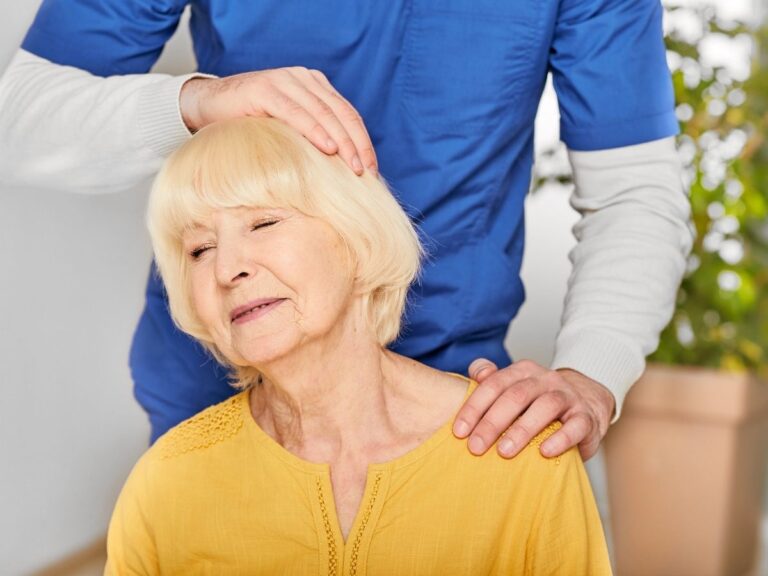 Senior woman receiving gentle neck therapy – neck pain treatment and mobility care for seniors in Los Angeles.
