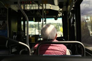 Senior boarding a public transit bus in Los Angeles, illustrating free senior transportation options
