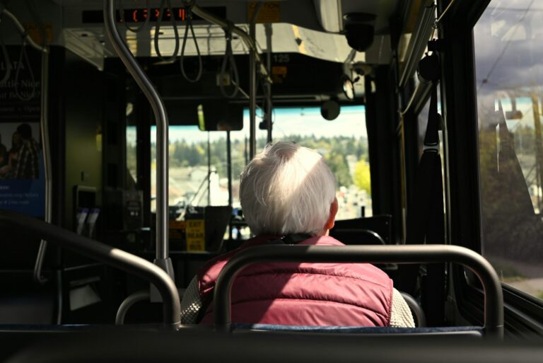 Older adult seated on a public transit bus in Los Angeles