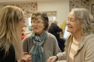 Adult child consoling aging parent, illustrating warning signs your aging parent needs help