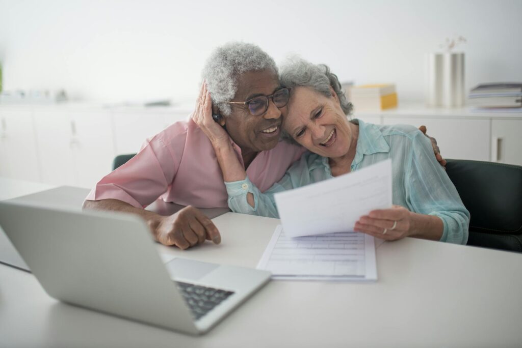 California senior reviewing Medicare Advantage plan options with caregiver support