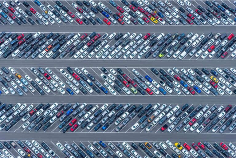 High-angle aerial photo showcasing a crowded parking lot filled with diverse vehicles in Florida.